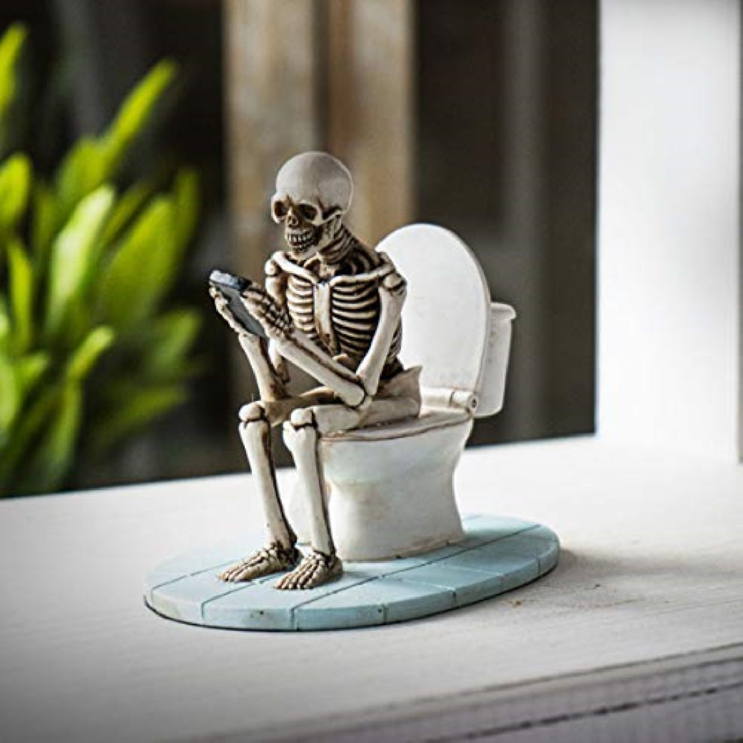Skeleton Sitting on Toilet Looking At Phone Figurine 4.25 inch