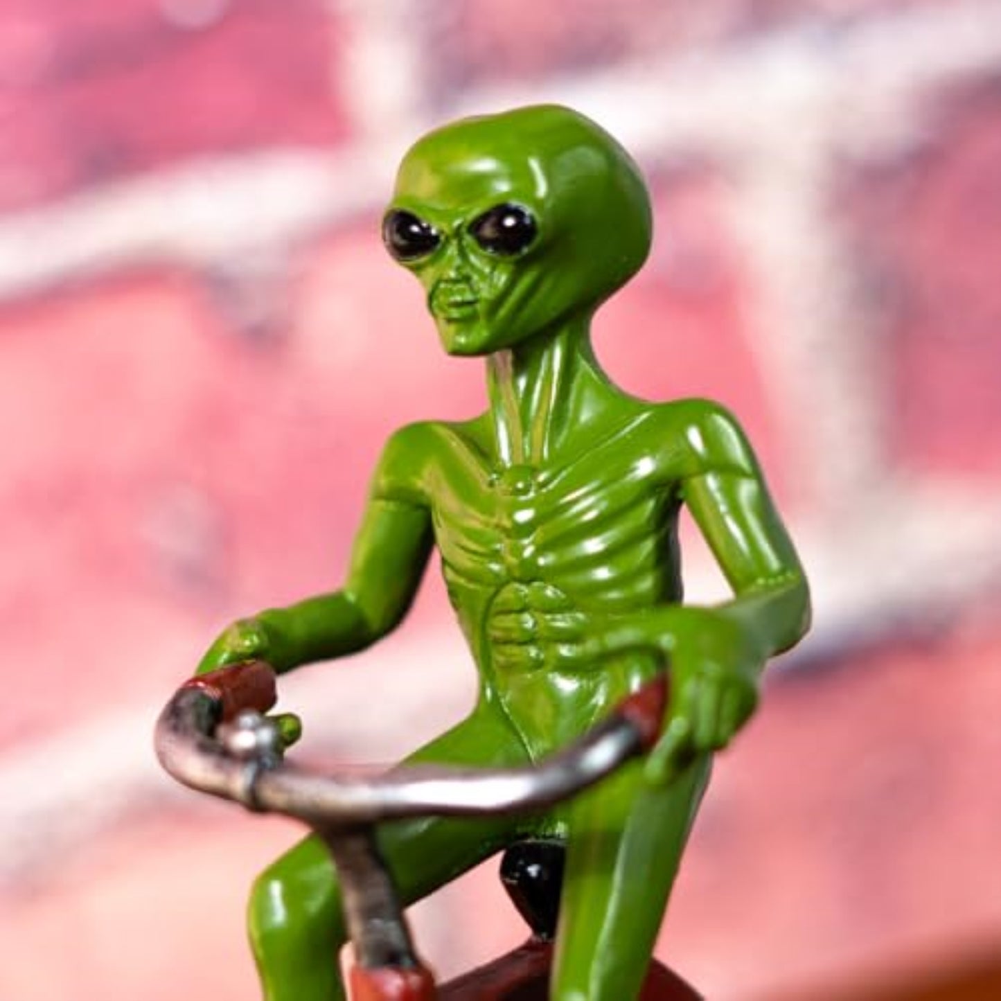 Green Alien Riding Tricycle Figurine Sci Fi Extraterrestrial Alien Go Home Theme 6.7 inch