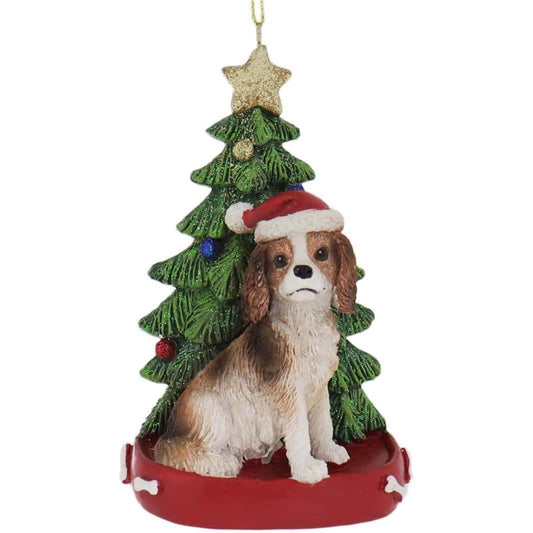 Kurt Adler Cavalier King Charles Dog Next to Christmas Tree Wearing Santa Hat Resin Ornament 4.25 inch